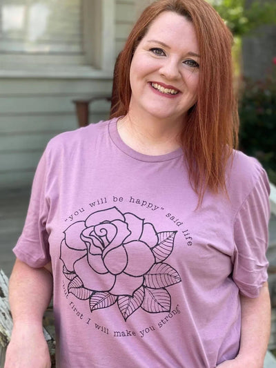 Women’s cotton shirt with a vibrant flower design and "You Will Be Happy" uplifting message.