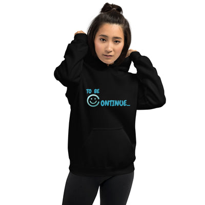 To Be Continue teal smiley face logo hoodie promoting mental health awareness and resilience.